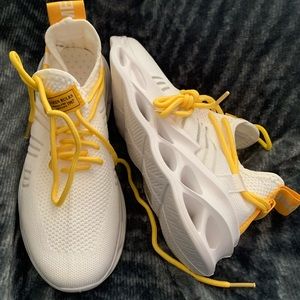 White athletic sneakers (new).